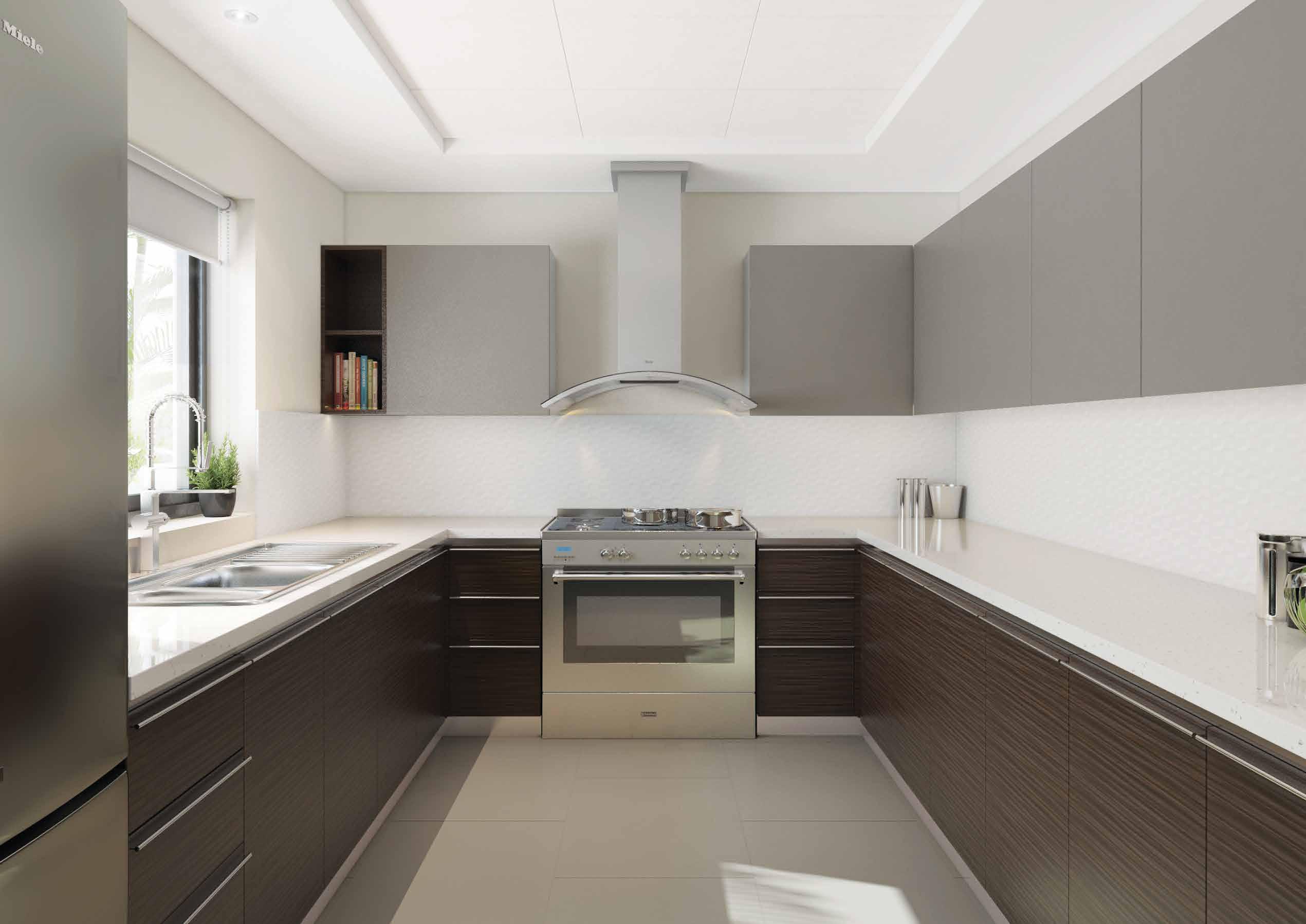 Modern kitchen in West Yas villa, Yas Island, Abu Dhabi with built-in cabinets, premium appliances, and island counter