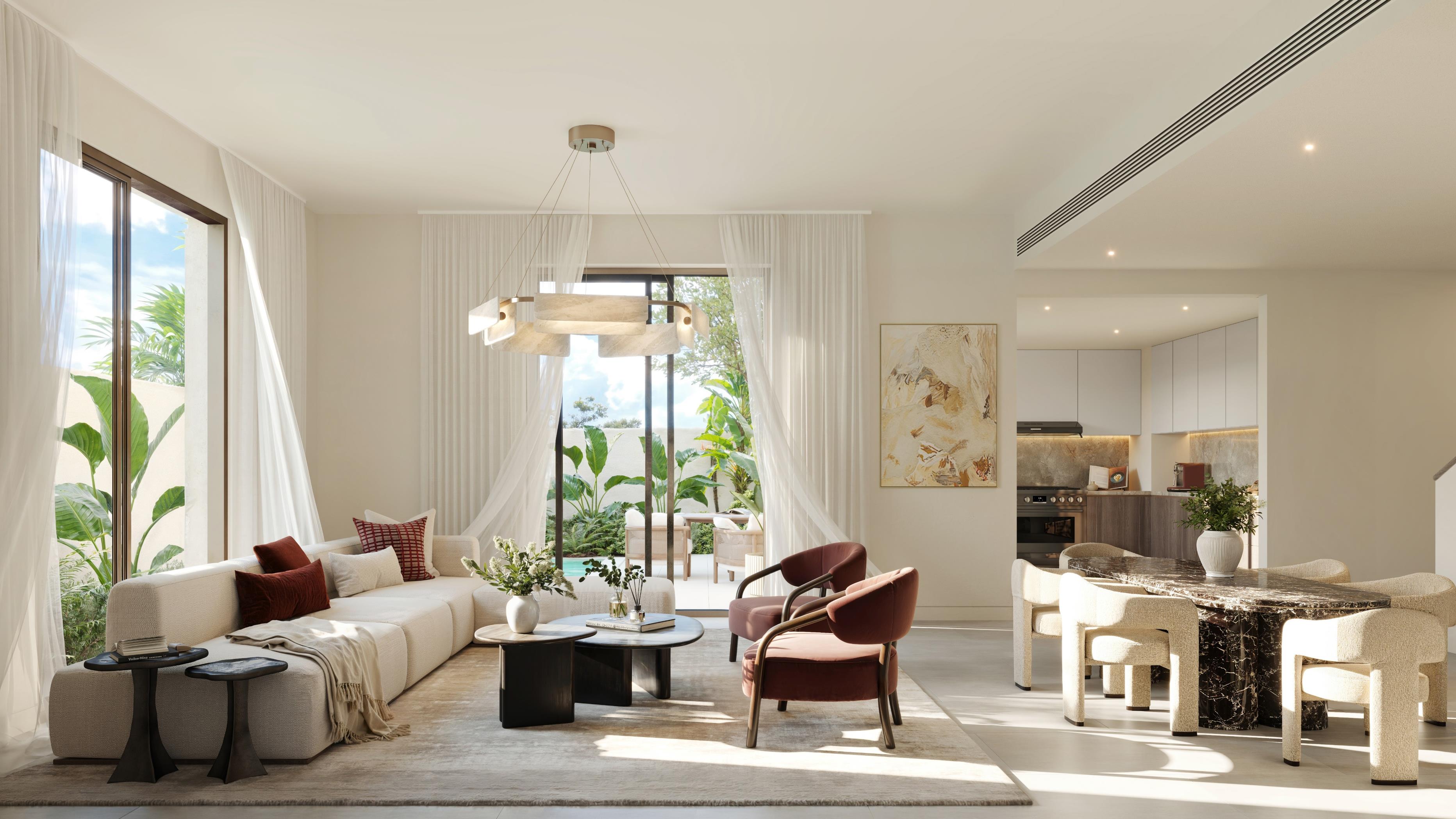 Dining and living area inside Yas Acres The Orchids Yas Island Abu Dhabi, offering seamless indoor‑outdoor flow and refined modern design.